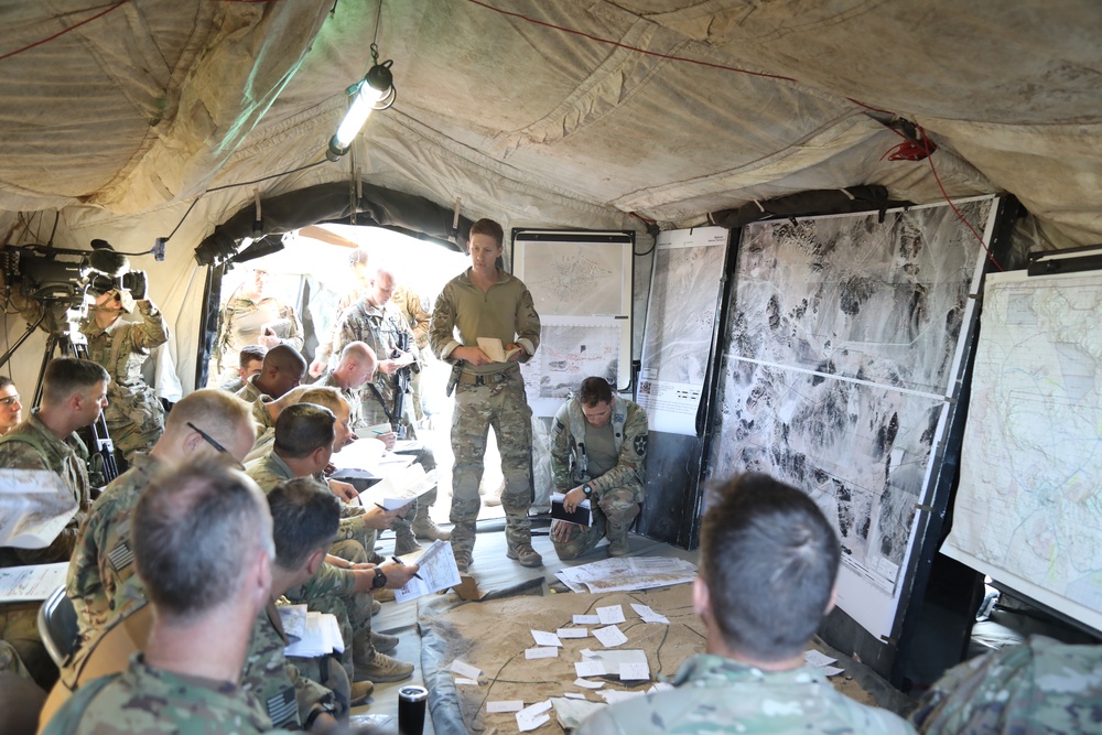 1st Lt. Dane Bevins briefs at Lancer Brigade's Combined Arms Rehearsal at NTC