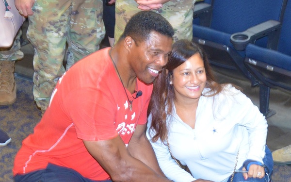 Herschel Walker poses with fan