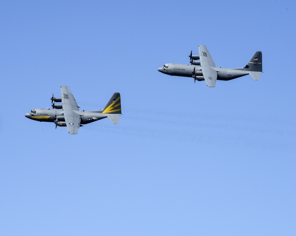 C-130H and C-130J fly in formation