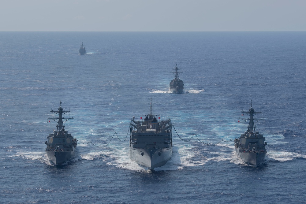 The guided-missile destroyer, USS Forrest Sherman (DDG 98), fast combat support ship USNS Supply (T-AOE 6), and guided-missile destroyer USS Gravely (DDG 107) conduct a refueling-at sea,