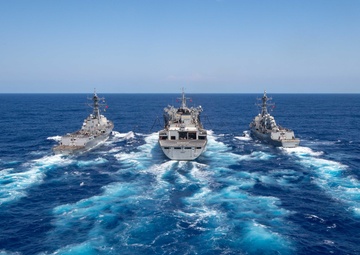 U.S. Navy ships conduct a refeuling-at-sea