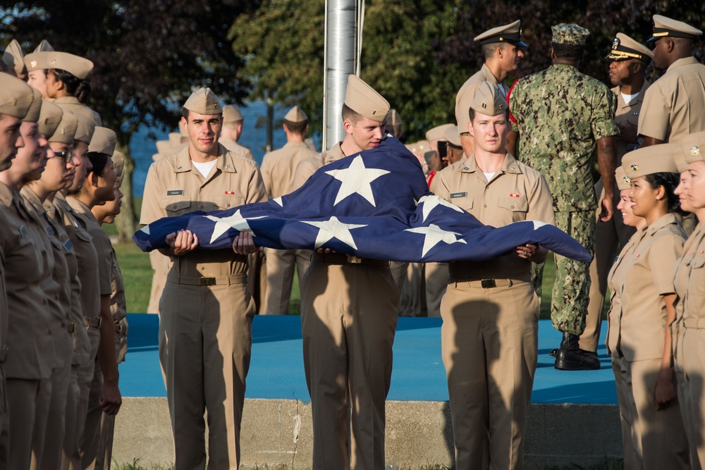190911-N-TE695-0001 NEWPORT, R.I. (Sept. 11, 2019) — Graduating class 19060 of Officer Development School (ODS) at Officer Training Command, Newport, Rhode Island, conducts a flag ceremony in remembrance of the 9/11 attacks on Sept. 11, 2019.
