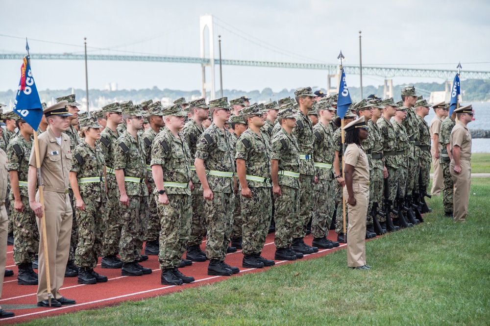 190911-N-TE695-0007 NEWPORT, R.I. (Sept. 11, 2019) -- Officer Candidate School (OCS) classes stand in formation for Old Glory