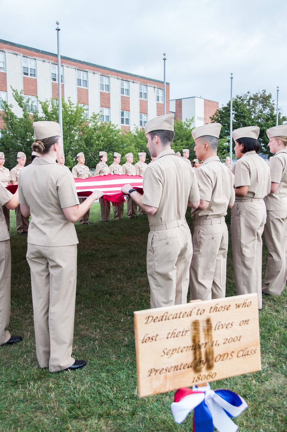 190911-N-TE695-0005 NEWPORT, R.I. (Sept. 11, 2019) — Graduating class 19060 of Officer Development School (ODS) at Officer Training Command, Newport, Rhode Island, conducts a flag ceremony in remembrance of the 9/11 attacks on Sept. 11, 2019.