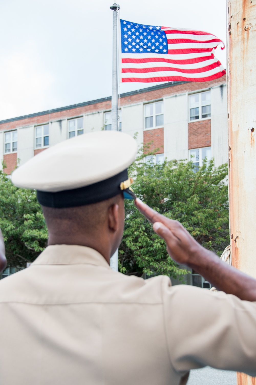190911-N-TE695-0015 NEWPORT, R.I. (Aug. 8, 2019) – Director of Officer Development School salutes the colors