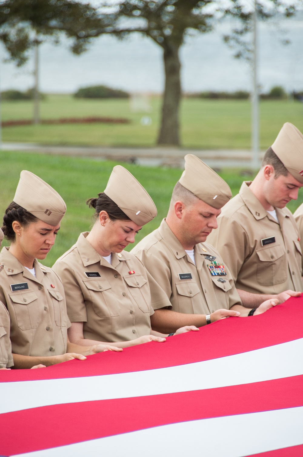 190911-N-TE695-0021 NEWPORT, R.I. (Sept. 11, 2019) – Students Officer Development School observe a moment of silence