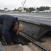 Sailor Conducts Maintenance On Catapult