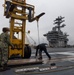 Nimitz Sailors Remove Cover On Catapult