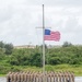 Sailors observe colors during 9/11 remembrance ceremony.
