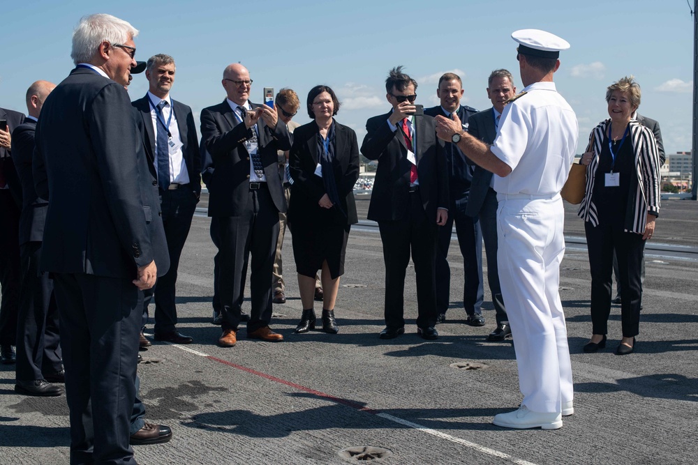 Distinguished visitors tour the aircraft carrier USS John C. Stennis (CVN 74)