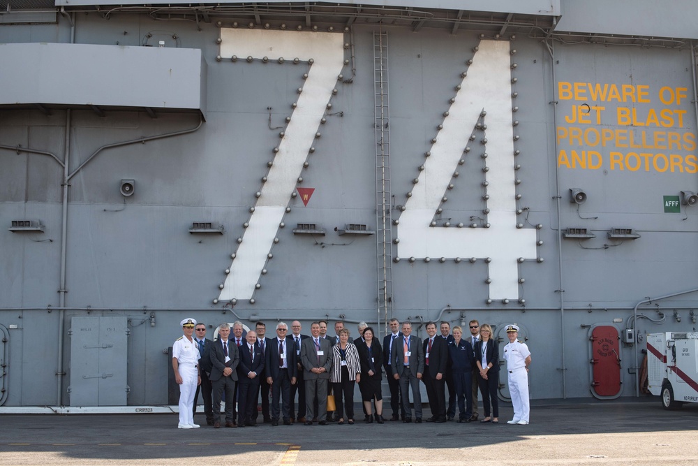 Distinguished visitors tour the aircraft carrier USS John C. Stennis (CVN 74)