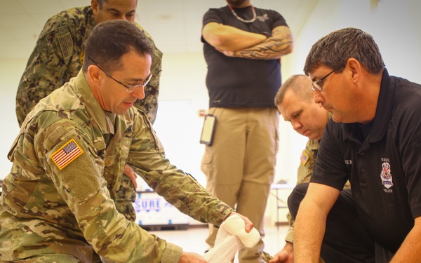 Law Enforcement, Army, Navy, Air Force Participate in Army Reserve K9 Casualty Training