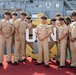 Chief Petty Officers aboard Avenger-class mine countermeasures ship USS Pioneer (MCM 9), pose for a celebratory picture during their Chief pinning ceremony.
