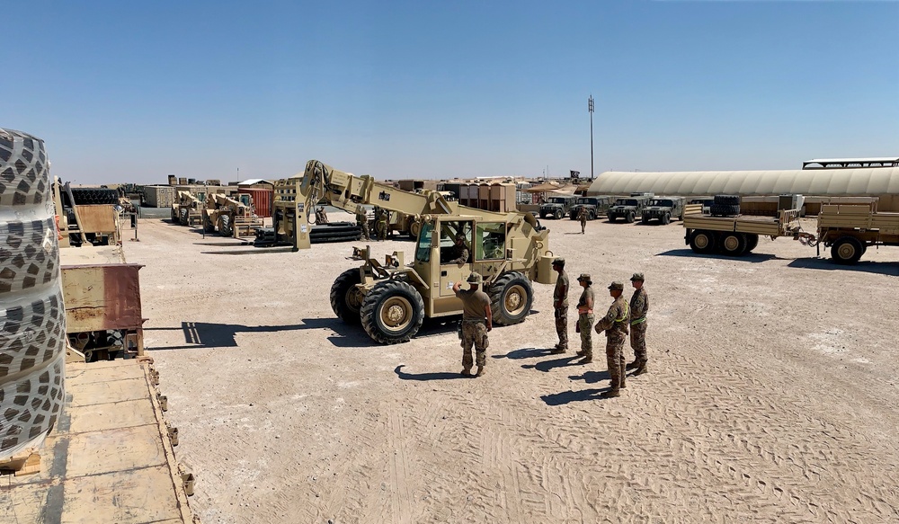 Soldiers from the 77th Sustainment Brigade operate the ATLAS forklift