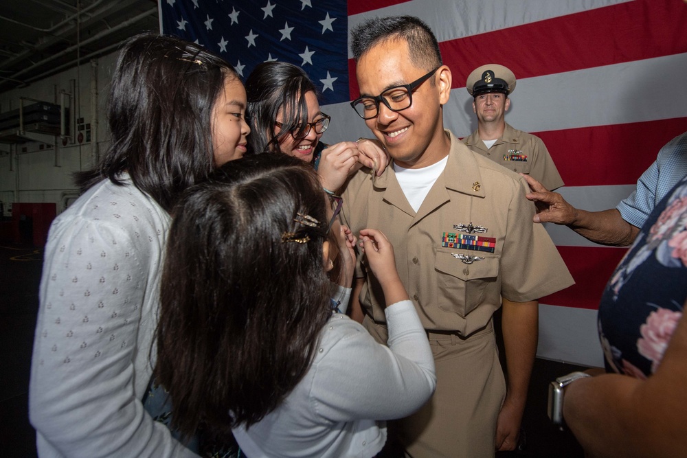 The aircraft carrier USS John C. Stennis (CVN 74) hosts a chief petty officer pinning ceremony
