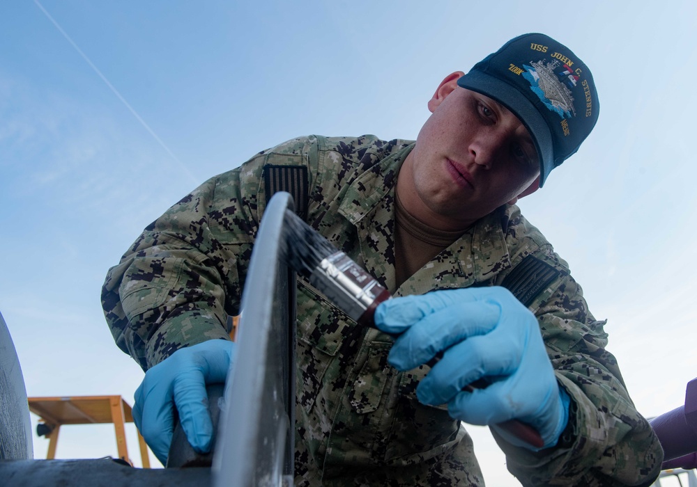 U.S. Sailors conducts preventive-corrosion maintenance