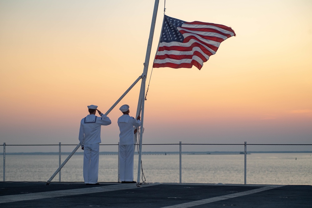 U.S. Sailors observe evening colors