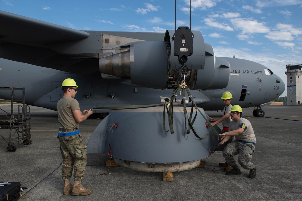 USAF Maintenance Airmen repair RAAF C-17