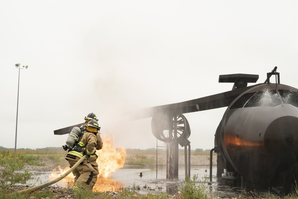 319th Civil Engineer Squadron Firefighters pair with Grand Forks International Airport Firefighters for exercise