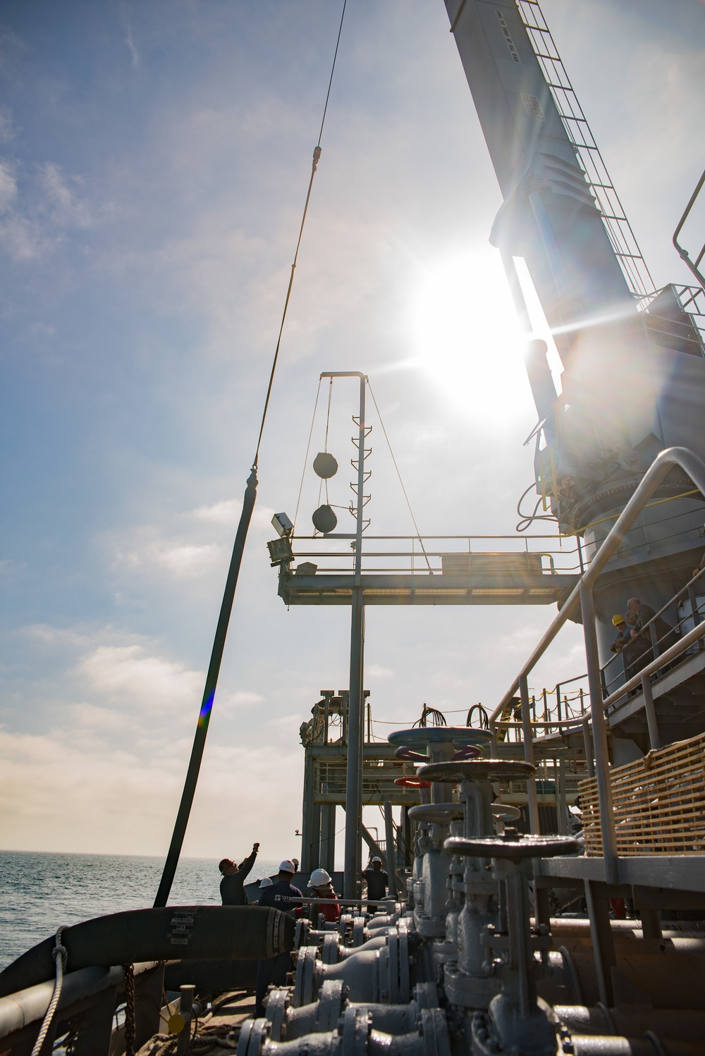 Crane Aboard SS Petersburg Lowers Hose for OPDS Operation