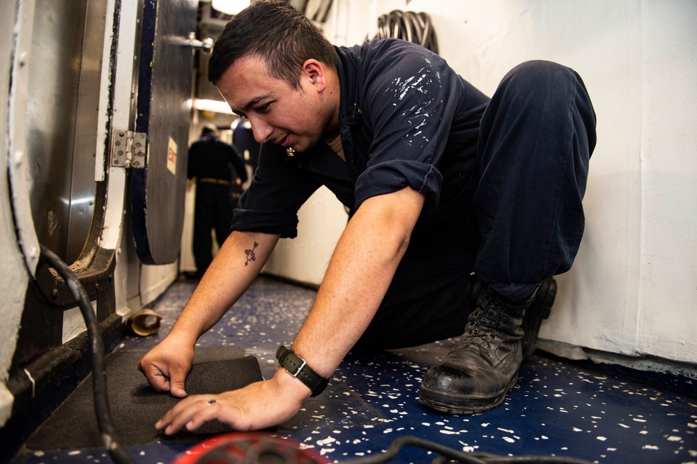 Sailors Aboard USS San Jacinto Lay Non-Skid