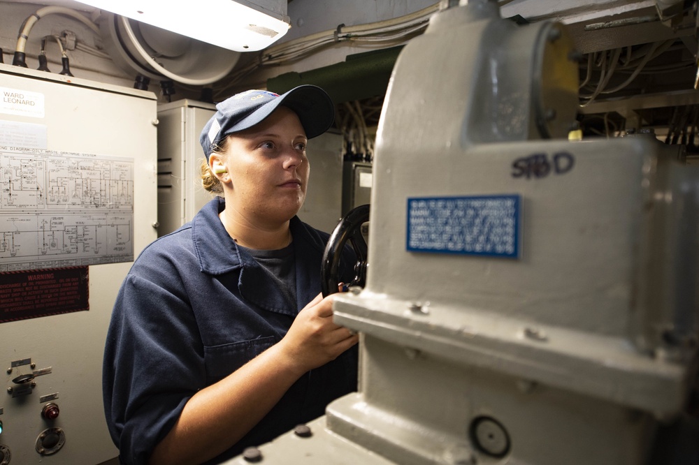 Sailros Aboard USS San Jacinto Man Aft-Steering