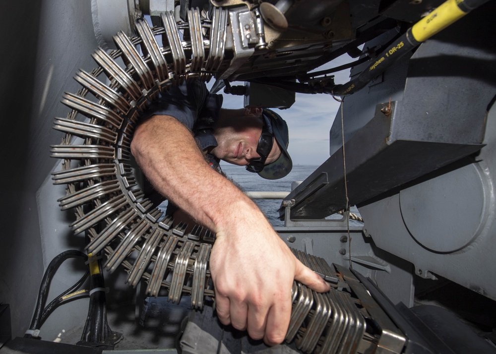 USS Normandy Sailor Performs Maintenance