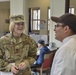 Commanding General's Summertime Competition: Capt. Amanda Cain and Staff Sgt. Jose Montero discuss available nutrition at Wings of Victory Dining Facility