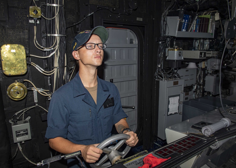 USS Normandy Sailor Stands Helmsman Watch