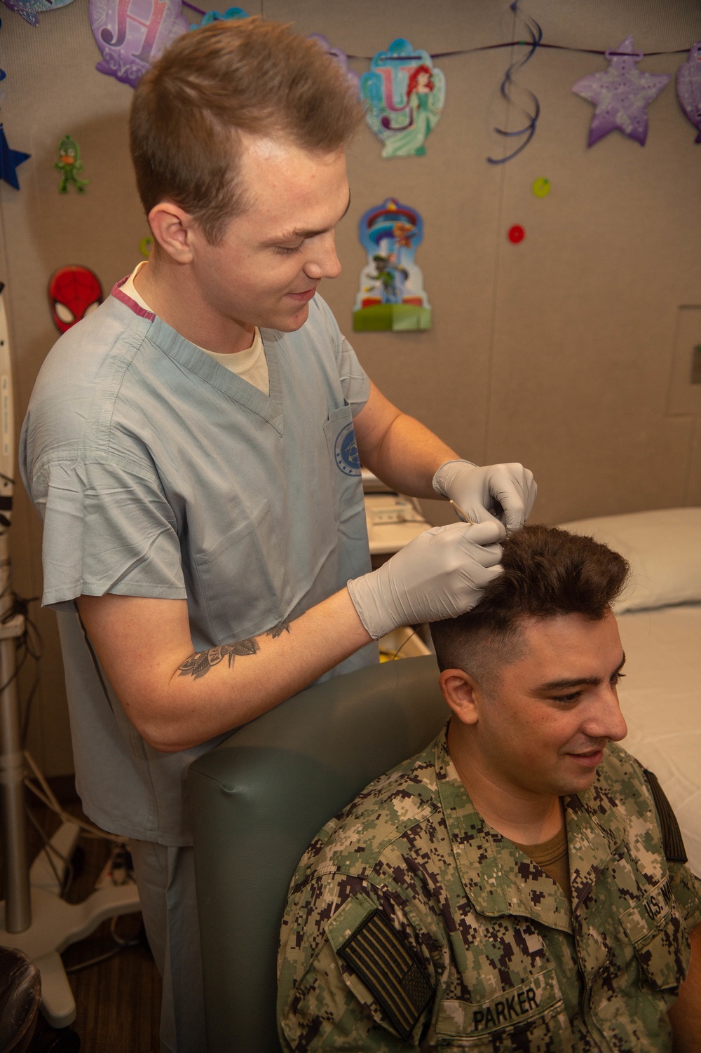 Sailor prepares patient