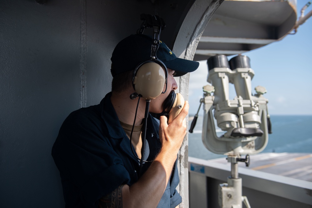 U.S. Navy Sailors stands watch aboard the aircraft carrier USS John C. Stennis