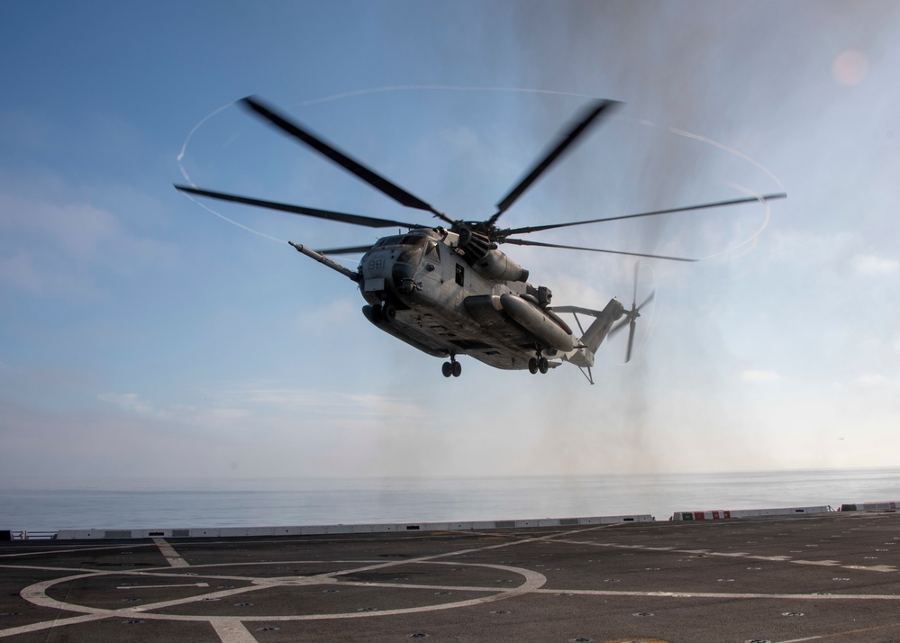 A CH-53E Sea Stallion  prepares to land aboard USS Somerset