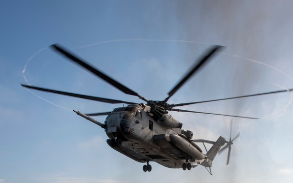 A CH-53E Sea Stallion  prepares to land aboard USS Somerset