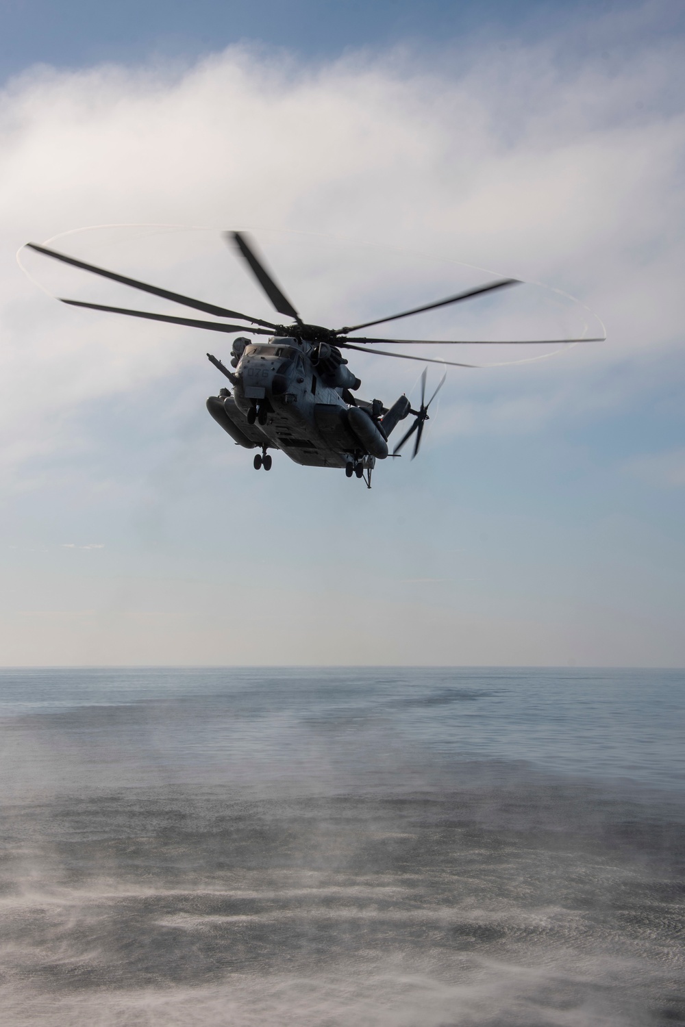 A CH-53E Sea Stallion prepares to land Aboard USS Somerset