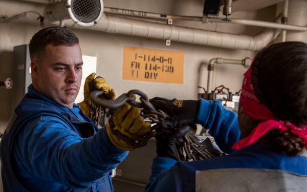Sailors Work in Hangar Bay of USS Somerset