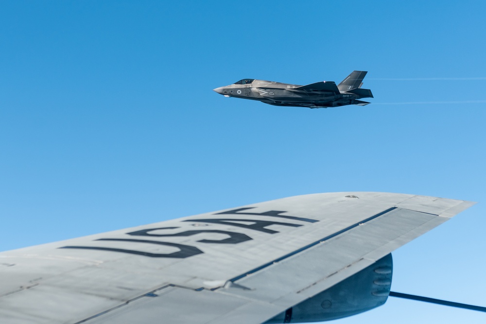 A RAF F-35 Lightning II flies with a KC-135 Stratotanker over England during a training mission