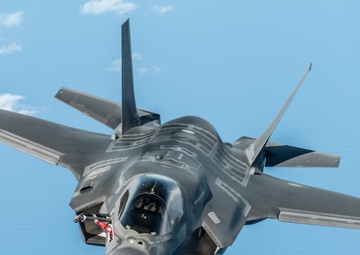 A RAF F-35 Lightning II prepares to be refueled by a KC-135 Stratotanker during a training mission over England