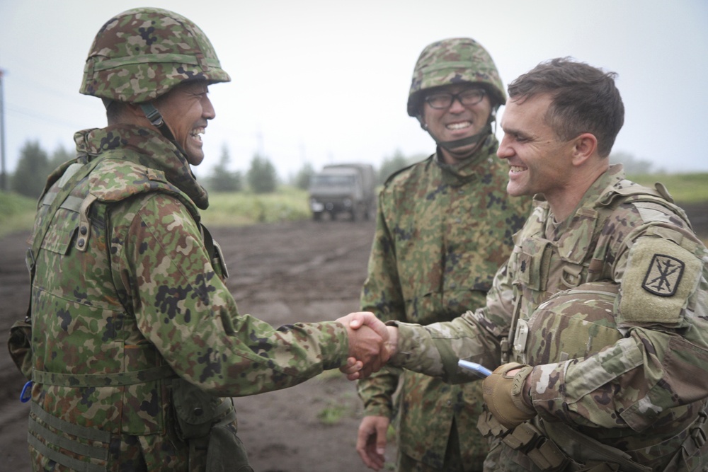 Battalion Commanders shake hands after successful planning and coordination of LFX