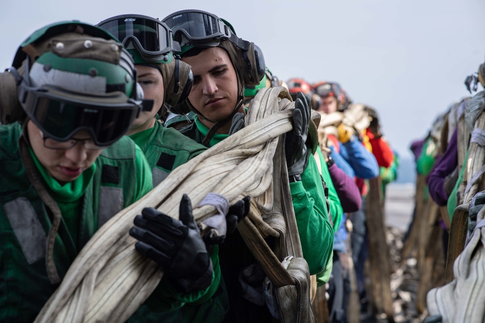 U.S. Sailors conduct a barricade drill