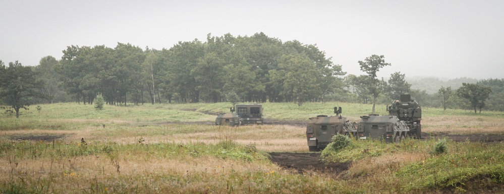 U.S. Army HIMARS and JGSDF MLRS Stand Ready during bilateral training exercise