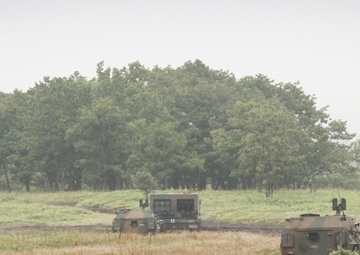 U.S. Army HIMARS and JGSDF MLRS Stand Ready during bilateral training exercise