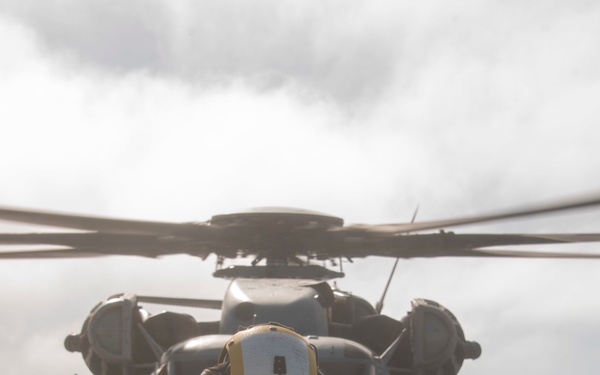 Sailor prepares to direct a Sea Stallion USS Somerset