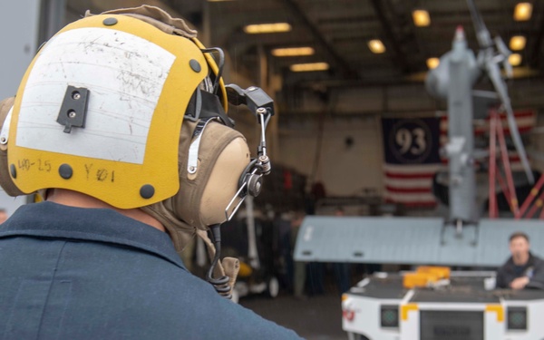 Sailor directs a helicopter on the flight deck USS Somerset