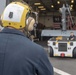 Sailor directs a helicopter on the flight deck USS Somerset