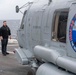 Sailor directs a helicopter on the flight deck of  USS Somerset