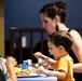 Families get served during Deployed Spouses Dinner