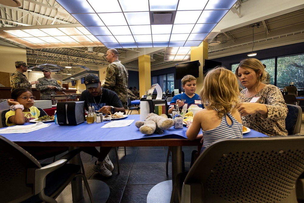 Families get served during Deployed Spouses Dinner