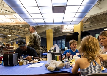 Families get served during Deployed Spouses Dinner