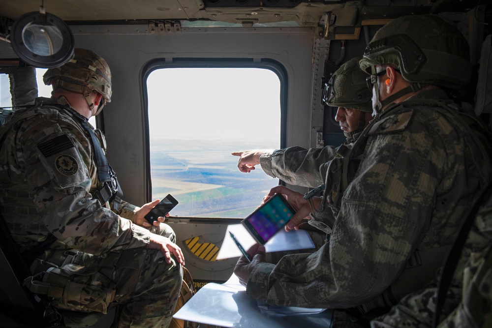 Black Hawk helicopters fly over Security Mechanism