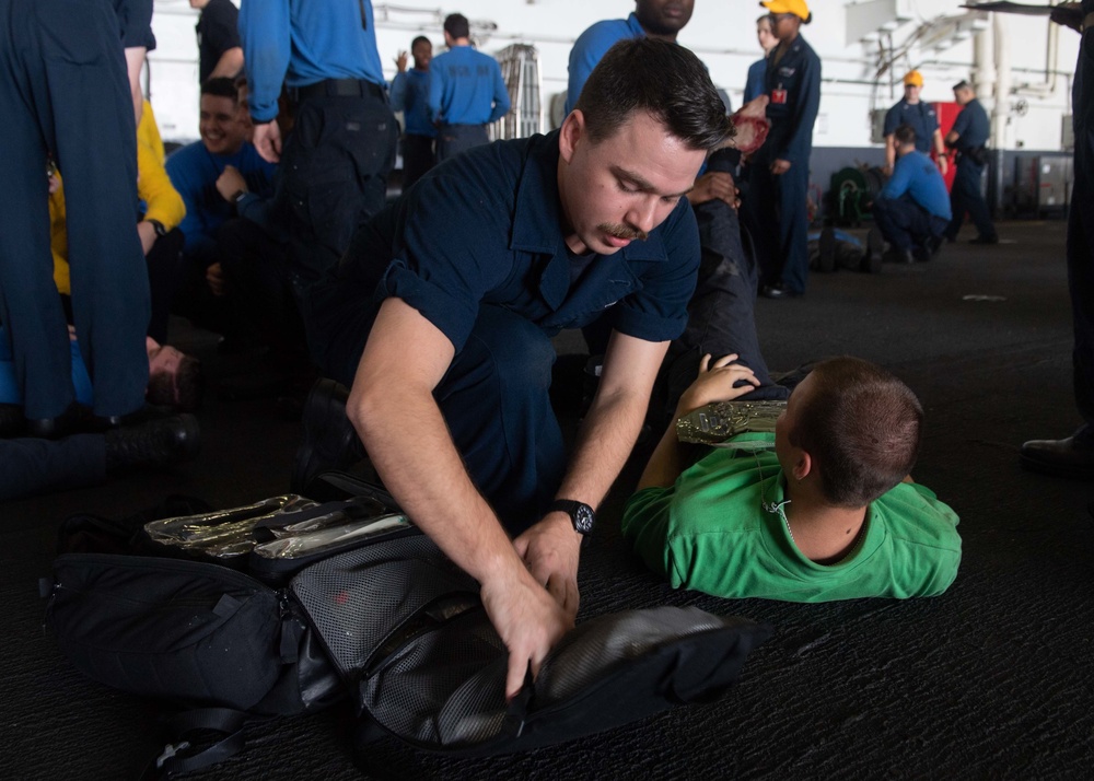 U.S. Sailors participate in a mass casualty drill